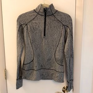 Lululemon size 4 long sleeve 1/4 zip jacket. Black and white heather print.